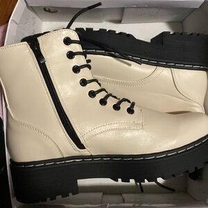 Cream and black combat boots
